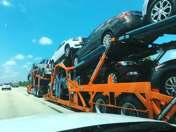 Car transporter on road seen through windshield