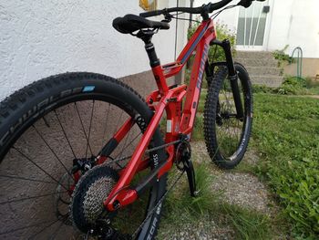 Bicycle parked against wall