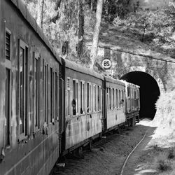 Kalka shimla toy train moving on mountain slope, beautiful view, 1 side mountain, 1 side valley