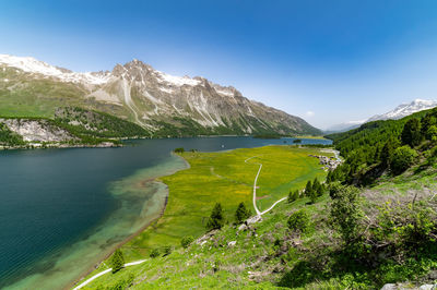 Upper engadine, lake sils, and the village of isola, photographed from above in summer.