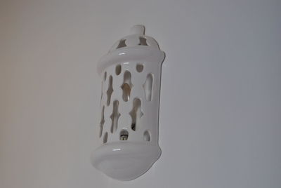 Close-up of electric lamp against white background