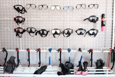 Diving equipment on table and hanging against wall