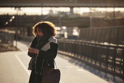 Young woman using cell phone