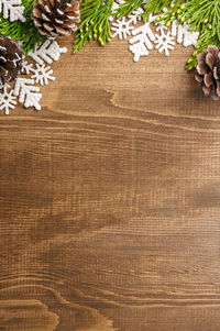 Directly above view of christmas decorations on wooden table