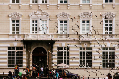 Group of people on building in city