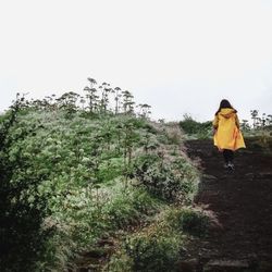 Full length of woman standing on field