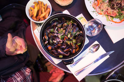 High angle view of mussels served in container