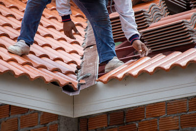 Low section of people standing on wood