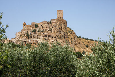 Low angle view of old ruins against clear sky