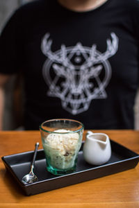 Close-up of coffee cup on table