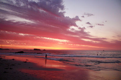 Scenic view of beach against sky during sunset