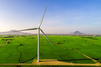 Scenic view of farm against sky