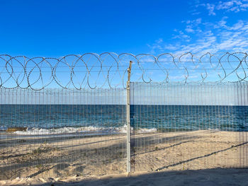 Barbed wire fence on a beach of a 5 star hotel in war torn northern mozambique