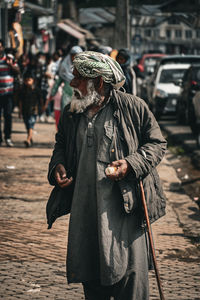 Rear view of woman walking on street