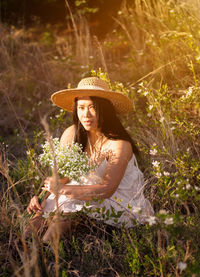 Young woman wearing hat on field