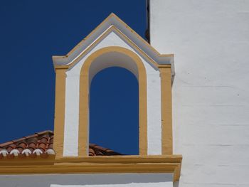 Low angle view of white building against clear sky