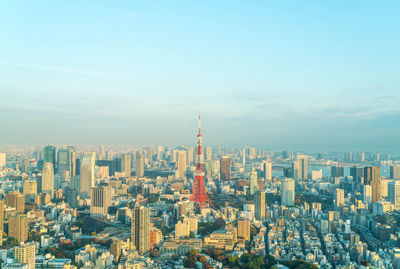 Aerial view of city buildings against sky