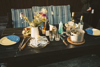 High angle view of food served on wooden table at holiday villa