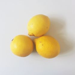 Close-up of fruit over white background