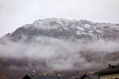 Clouds on mountain against sky