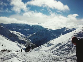 Woman standing on snow covered landscape