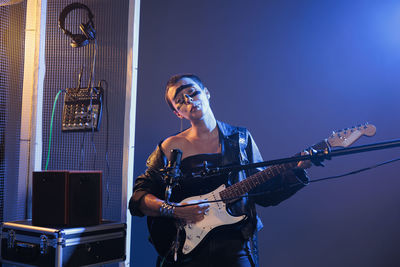 Young man playing guitar