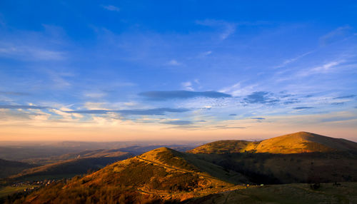 Scenic view of mountains against sky during sunset