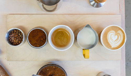 High angle view of coffee cups on table