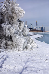 Frozen lake against sky during winter