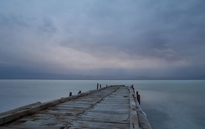 Pier over sea against sky