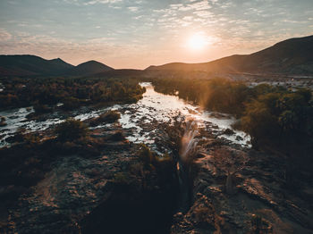 Scenic view of mountains against sky during sunset