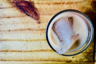 Directly above shot of beer in glass on table