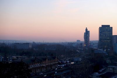 High angle view of buildings against sky during sunset