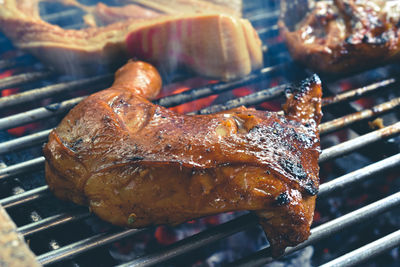 Close-up of meat cooking on barbecue grill