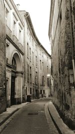 Road amidst buildings in city