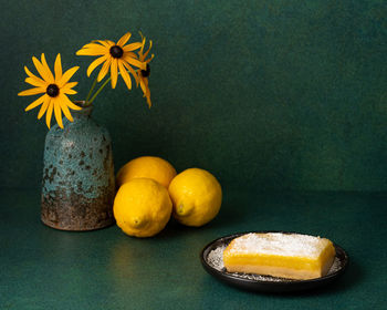 Close-up of yellow flowers in vase