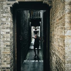 Rear view of man on entrance of building