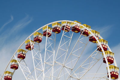 Low angle view of ferris wheel against sky