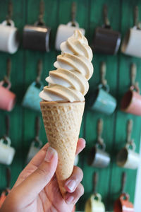 Close-up of hand holding ice cream