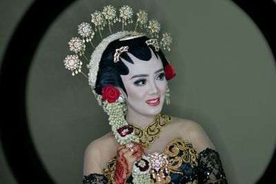 Portrait of young woman wearing traditional clothing