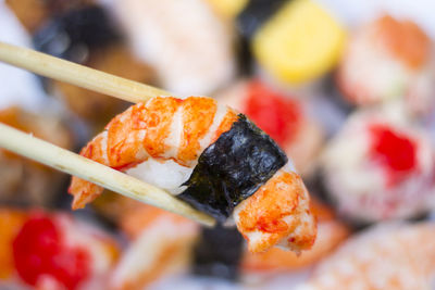 Close-up of sushi served on barbecue