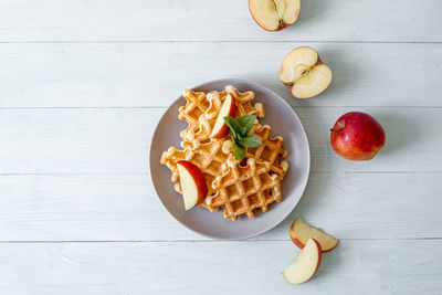 Waffles with apples on a plate