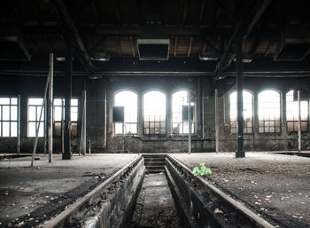 Railroad tracks in abandoned hangar