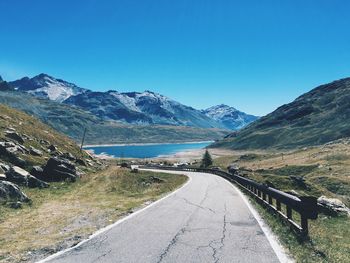 Scenic view of mountains against clear blue sky