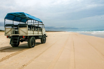 View of road on beach against sky