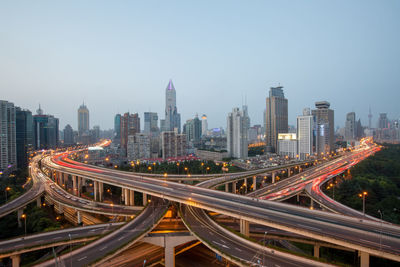 High angle view of light trails on road in city