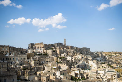 Buildings in city against sky