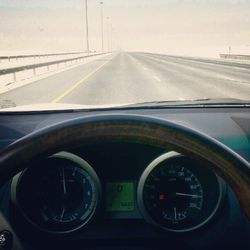 Road seen through car windshield