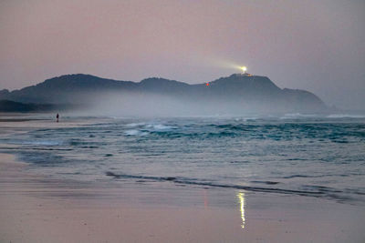 Scenic view of sea against clear sky during sunset