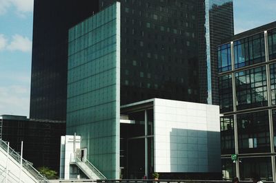 Low angle view of modern buildings against sky